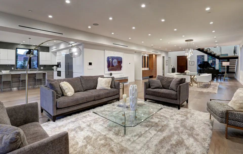 Living room opening into a kitchen